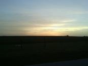 Sun setting over a Missouri field as I rode to the campground